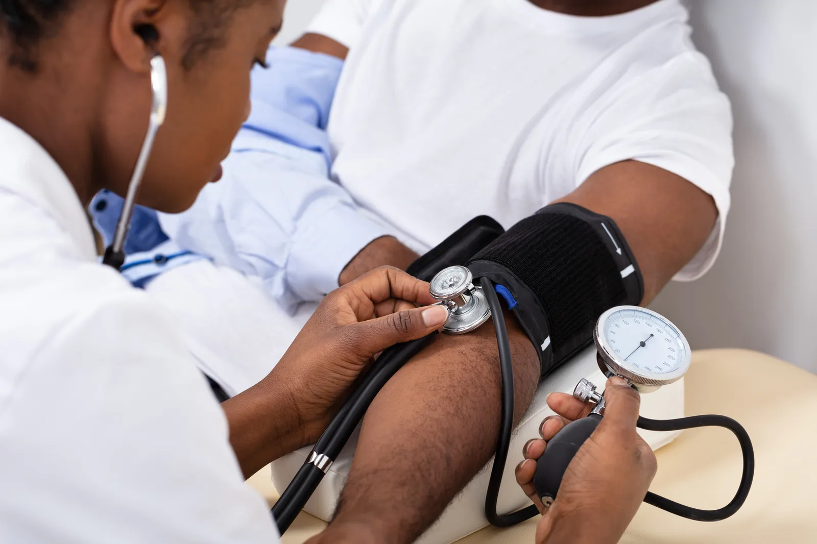 Nurse checking blood pressure